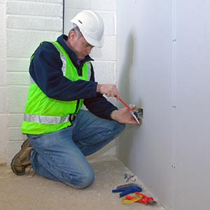 Photo of Electrician installing power sockets